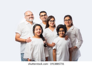 Multigenerational Indian Asian Smart Family Wears Clear Eye Glasses Or Spects Or Spectacles Against White Background