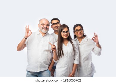 Multigenerational Indian Asian Smart Family Wears Clear Eye Glasses Or Spects Or Spectacles Against White Background