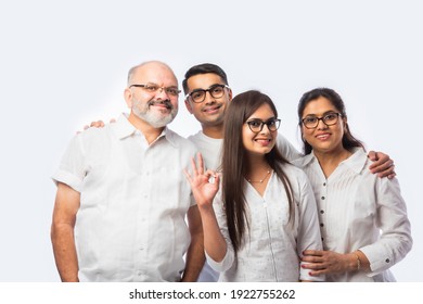 Multigenerational Indian Asian Smart Family Wears Clear Eye Glasses Or Spects Or Spectacles Against White Background