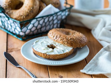 A multigrain bagel with cream cheese. - Powered by Shutterstock