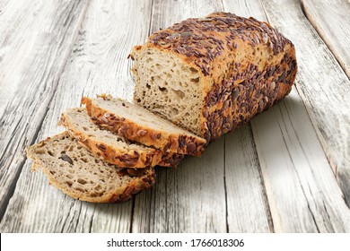 Multigrain Traditional Brown Farmhouse Sliced Bread Loaf on Wooden Background  - Powered by Shutterstock