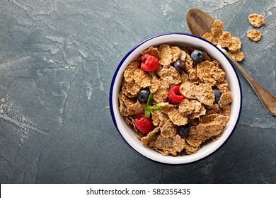 Multigrain wholewheat healthy cereals with fresh berry for breakfast overhead shot with copyspace. - Powered by Shutterstock