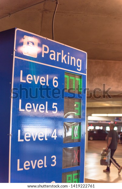 Multi-level garage smart guidance\
system with LED lighted numbers showing available or full spaces on\
each level. Intelligent indoor parking garage\
management