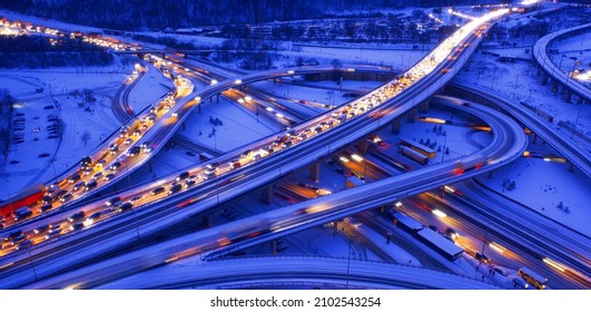 Multilevel transport interchange. Winter landscape. Lanterns illuminate the road.