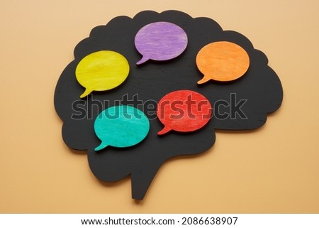 Multilingual concept. Brain shape and bubble quotes.