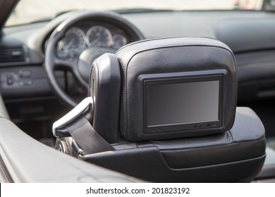 Multimedia Backseat Screen In A Luxury Car