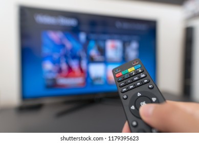 Multimedia Streaming Concept. Hand Holding Remote Control. Video On Demand