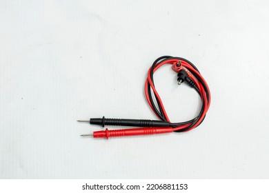 The Multimeter Probe Wires Are Red And Black. Positive And Negative Wires