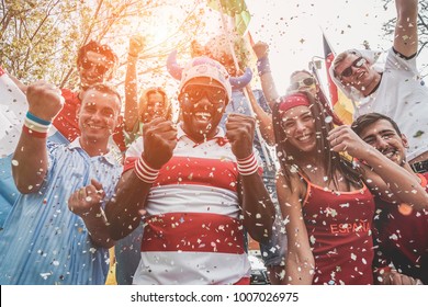 Multinational Football Supporters Celebrating The Begin Of World Competition - Happy Multiracial People Having Fun Together Outside Of Stadium - Main Focus On Black Man - Sport And Bonding Concept