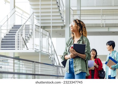 Multinational group smiling inside the building. International students. - Shutterstock ID 2323347745