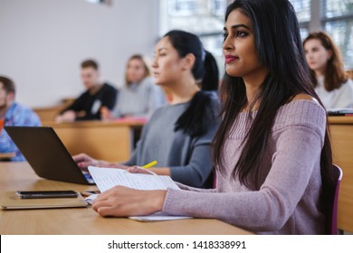 Multinational group of students in an auditorium - Shutterstock ID 1418338991