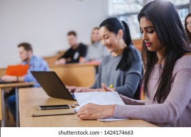 Multinational group of students in an auditorium - Shutterstock ID 1424174663