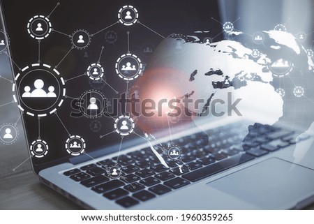 Multiple application icons with a laptop in the background, social network and online interaction concept, double exposure