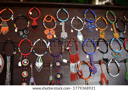 Multiple beed necklaces on display