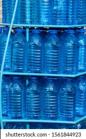 Multiple Big Blue Plastic Bottles Of Water. 