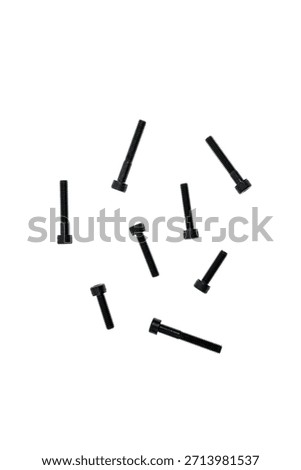 Multiple black allen head cap screws scattered randomly on a clean white background.