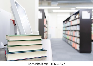 Multiple Books Piled Up In The Library