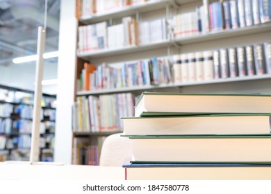 Multiple Books Piled Up In The Library