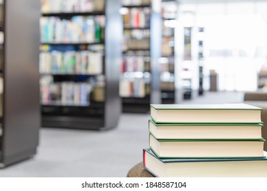 Multiple Books Piled Up In The Library