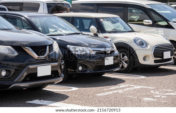 Multiple cars are\
parked in the parking\
lot.