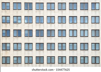 Multiple Closed Windows On A Large Office Building