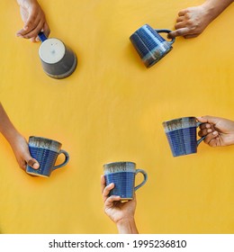 Multiple Coffee Mugs Held By Hands