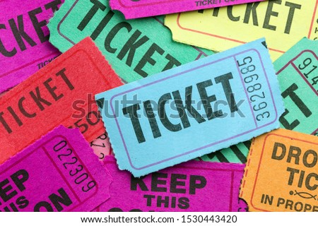Multiple color paper show tickets in pile