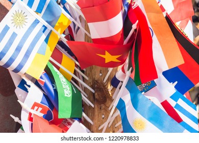 Multiple colorful flags of different countries, concept of travel, freedom, politics, diplomatics and other themes