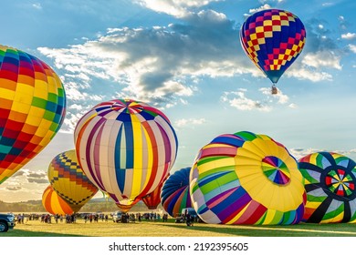 Multiple Colorful Giant Balloons Are Being Blown At The Balloons Festival