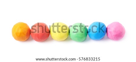 Multiple colorful plasticine balls arranged in a line, composition isolated over the white background