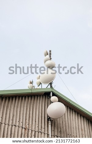 Multiple communicaiton antenna on rooftop pillar - fixed, mobile, radionavigation-satellite radiolocation, radiolocation