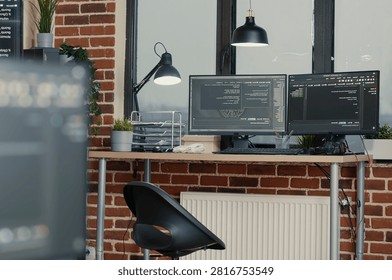 Multiple computer monitors display parsing code and programming language compiling in an empty software development agency office.