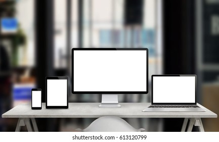 Multiple Devices For Responsive Web Site Promotion. Computer Display, Laptop, Tablet And Smart Phone With White, Isolated Screen. Office In Background.