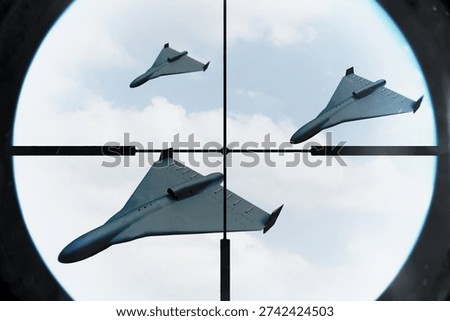 Multiple drones flying in sky tracked by air defense sight.
