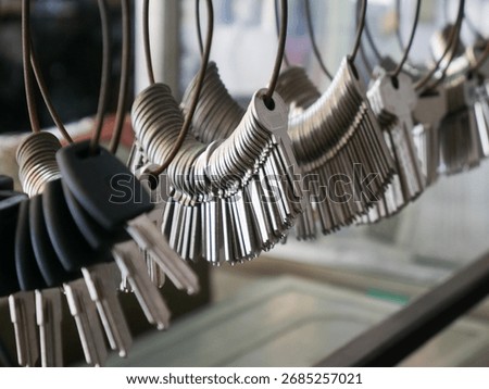 Multiple Duplicate Keys Hanging on Wire Rings at Locksmith Shop - Key Cutting and Duplication Service Business