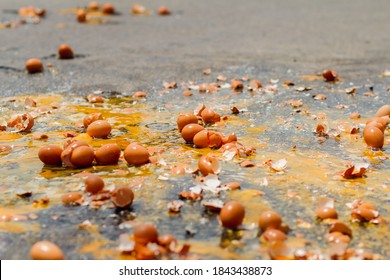 Multiple Eggs Crashed On The Road Due To An Accident In An Egg Delivery Truck That Was About To Deliver Eggs To Restaurants In The Morning. Concept Of Accidental Loss And Delay