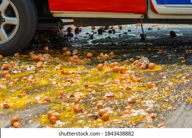 Multiple Eggs Crashed On The Road Due To An Accident In An Egg Delivery Truck That Was About To Deliver Eggs To Restaurants In The Morning. Concept Of Accidental Loss And Delay