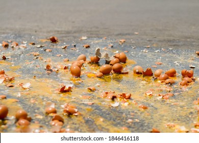 Multiple Eggs Crashed On The Road Due To An Accident In An Egg Delivery Truck That Was About To Deliver Eggs To Restaurants In The Morning. Concept Of Accidental Loss And Delay