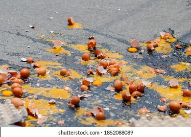 Multiple Eggs Crashed On The Road Due To An Accident In An Egg Delivery Truck That Was About To Deliver Eggs To Restaurants In The Morning. Concept Of Accidental Loss And Delay