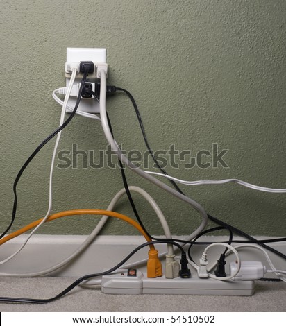 Multiple electrical plugs in wall outlet