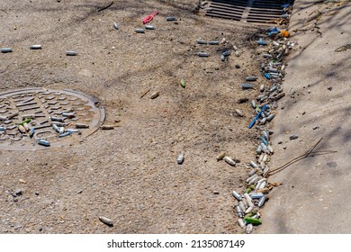 Multiple Empty Nitrous Oxide Canisters Litter The Street Near A Drain On Broadway Street Near Tulane University In New Orleans, LA, USA 