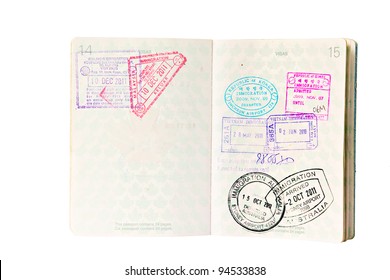 Multiple entries into South East Asia and Australia, resulting in many entry and exit stamps in a Canadian passport. Isolated on white.