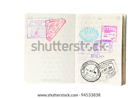 Multiple entries into South East Asia and Australia, resulting in many entry and exit stamps in a Canadian passport. Isolated on white.