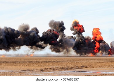 Multiple  explosions on a sandy beach