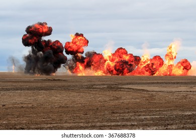 Multiple  explosions on a sandy beach