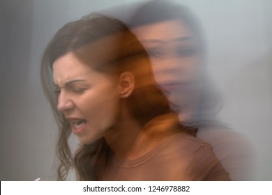 Multiple Exposure Of An Angry Woman On Grey Background