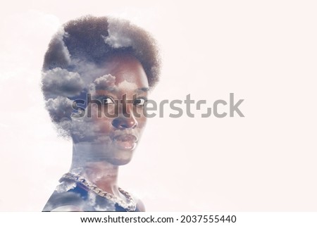 Multiple exposure image with clouds and sky inside african american woman portrait. Mental health and calm.
