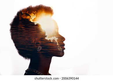 Multiple exposure image with sunrise and sea inside african american woman silhouette. Black Lives Matter mental state and freedom mindset concept.