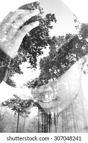 Multiple Exposure Portrait Of Woman Wearing Hat Combined With Photograph Of Trees Covered With Snow