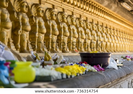 Multiple golden colour statues of lord Buddha at Kelaniya temple.